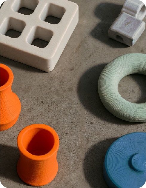 Industrial components coated with UV-cured powder coatings in various colors, developed by Keyland Polymers.